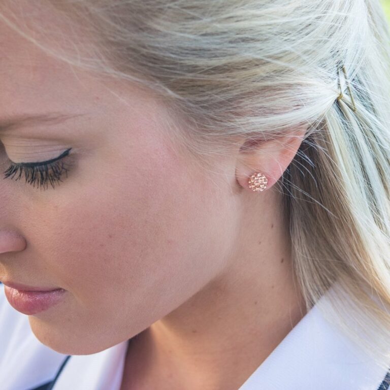 Why Do Golfers Wear Earrings: Style, Symbolism, and Performance